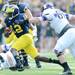 Michigan quarterback Devin Gardner runs the ball for yards in the second quarter against Northwestern at Michigan Stadium on Saturday. Melanie Maxwell I AnnArbor.com